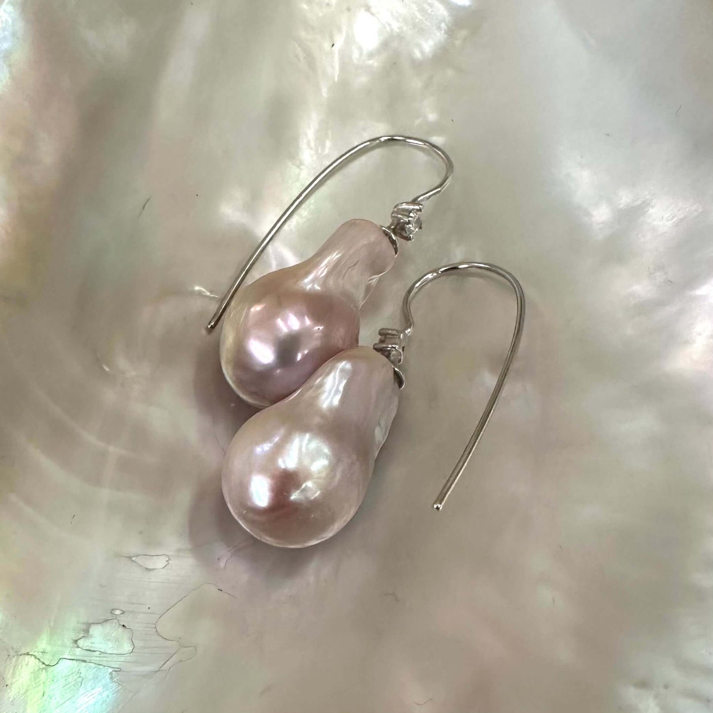 Lavender Baroque Pearl Earrings – silver design displayed on white pearl shell