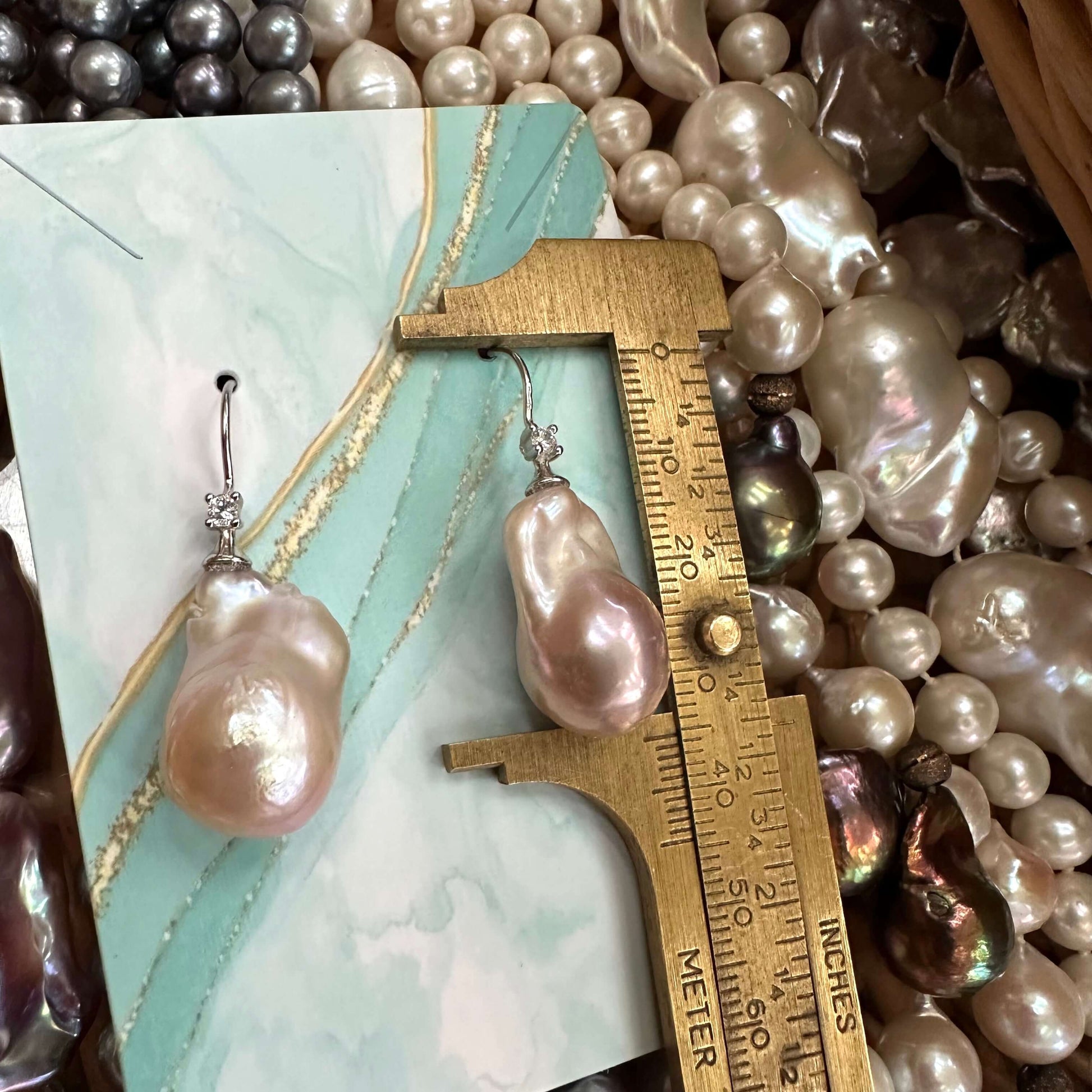Lavender Baroque Pearl Earrings – measured for size against turquoise ruler backdrop