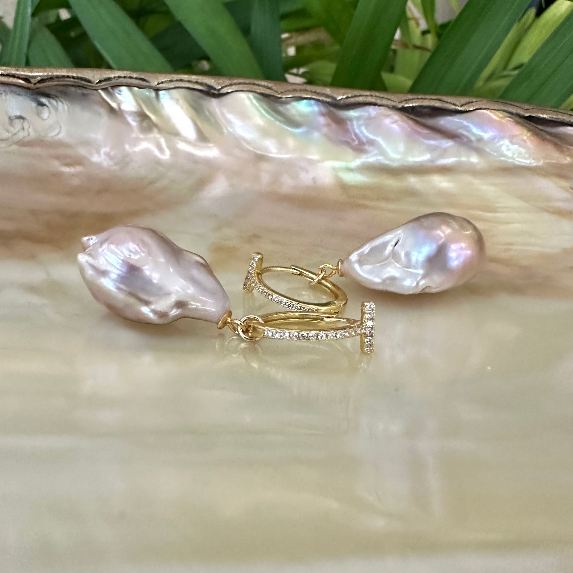 Pink baroque pearl hoop earrings detailed view on pearl shell, handcrafted freshwater jewelry from Canada.