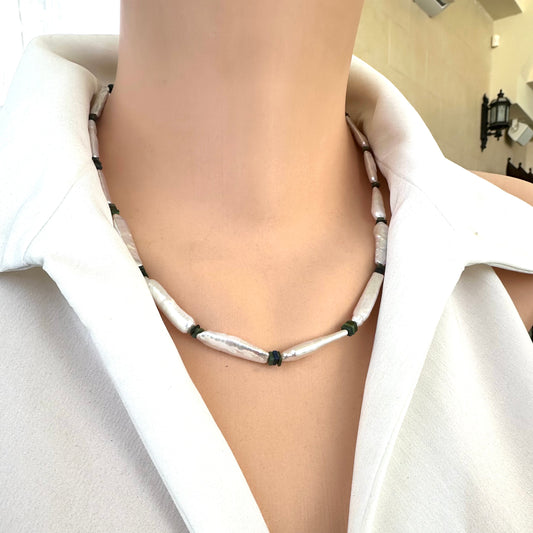 Detailed side angle of handmade biwa pearl and black opal necklace on mannequin