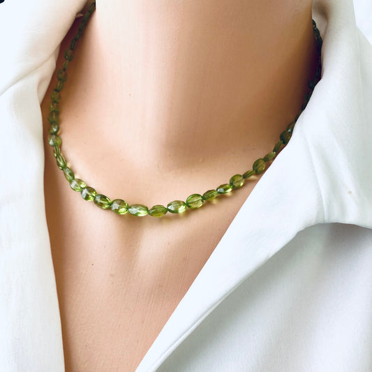 Peridot necklace 14K gold filled displayed on a mannequin, showcasing genuine Peridot gemstones and a delicate design.