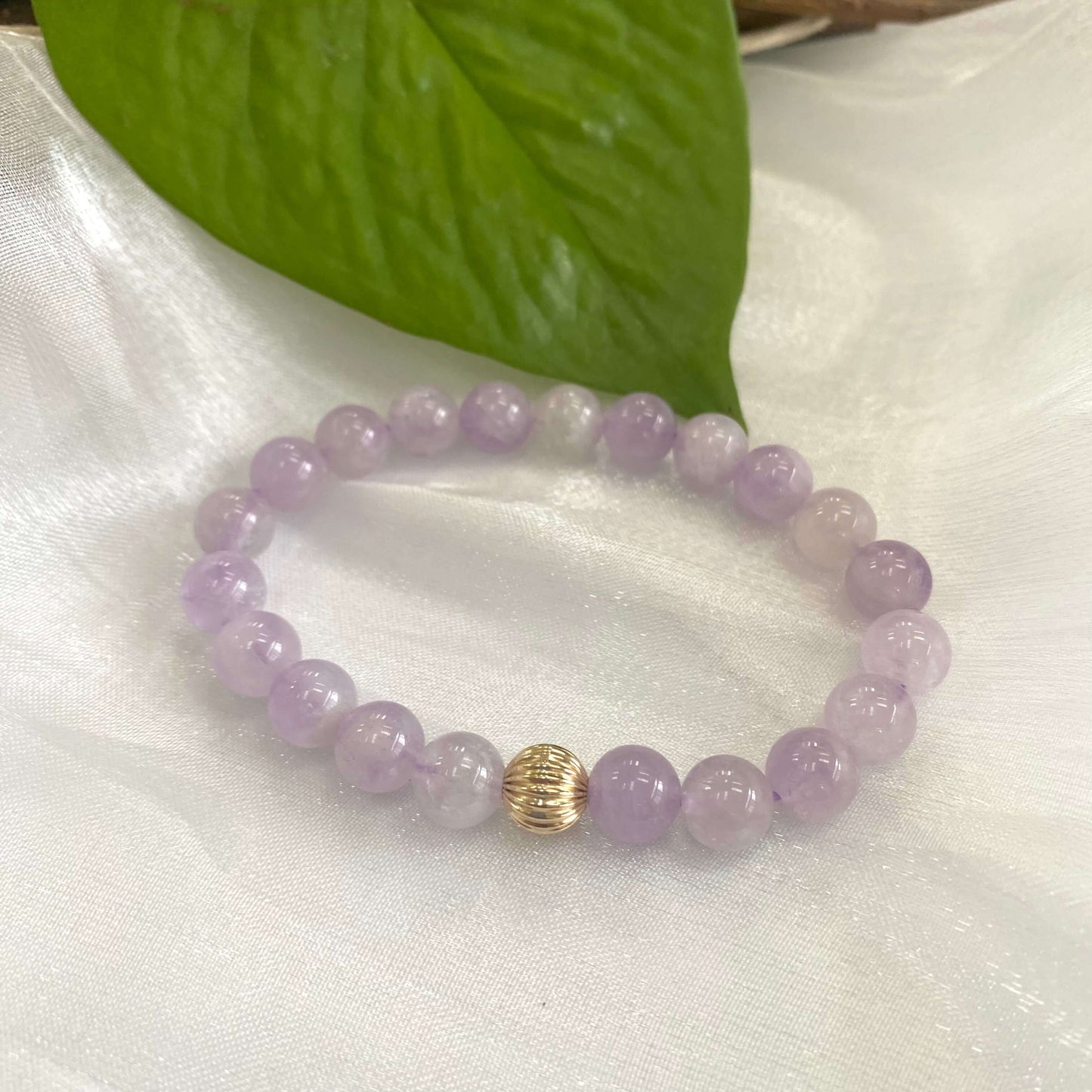 Lavender amethyst stretch bracelet with 6mm beads and 14K gold filled accent.