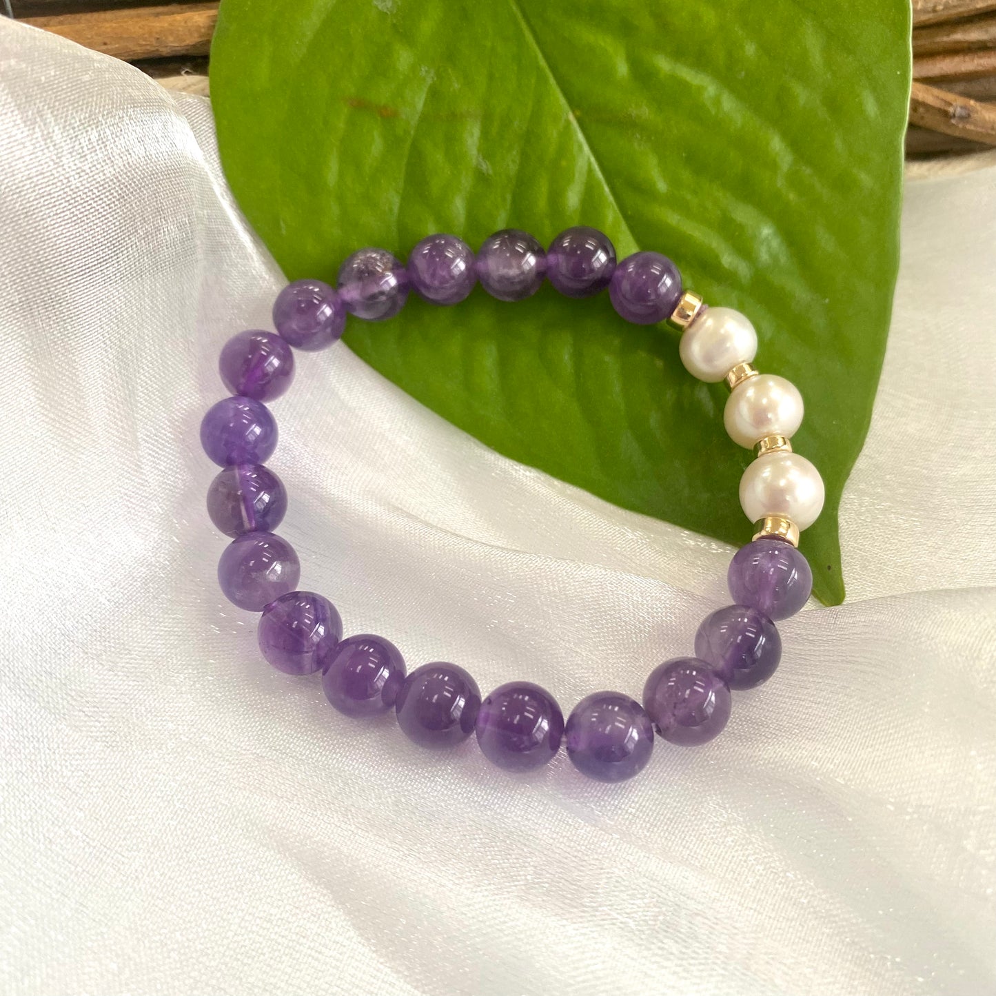 Amethyst Pearl Bracelet close-up on white cloth – individual gold filled design