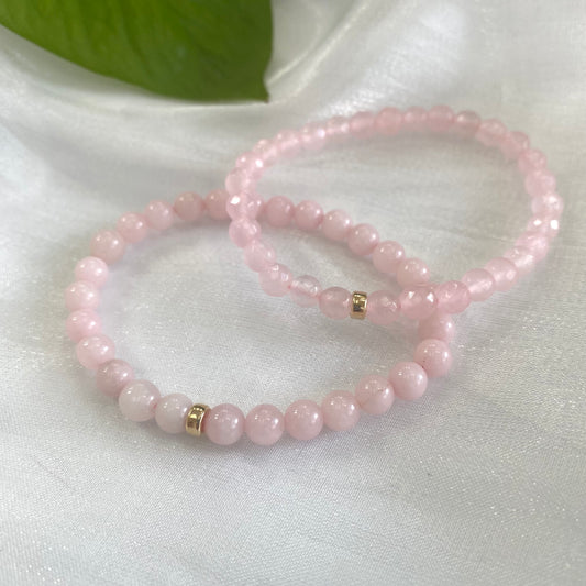 Rose quartz stretch bracelet featuring 6mm beads and 14K gold filled accents, perfect for layering or solo wear.
