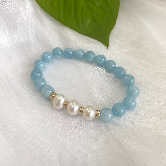 Aquamarine pearl bracelet with 8mm beads and 14K gold filled accents, showcasing blue aquamarine and freshwater pearls.