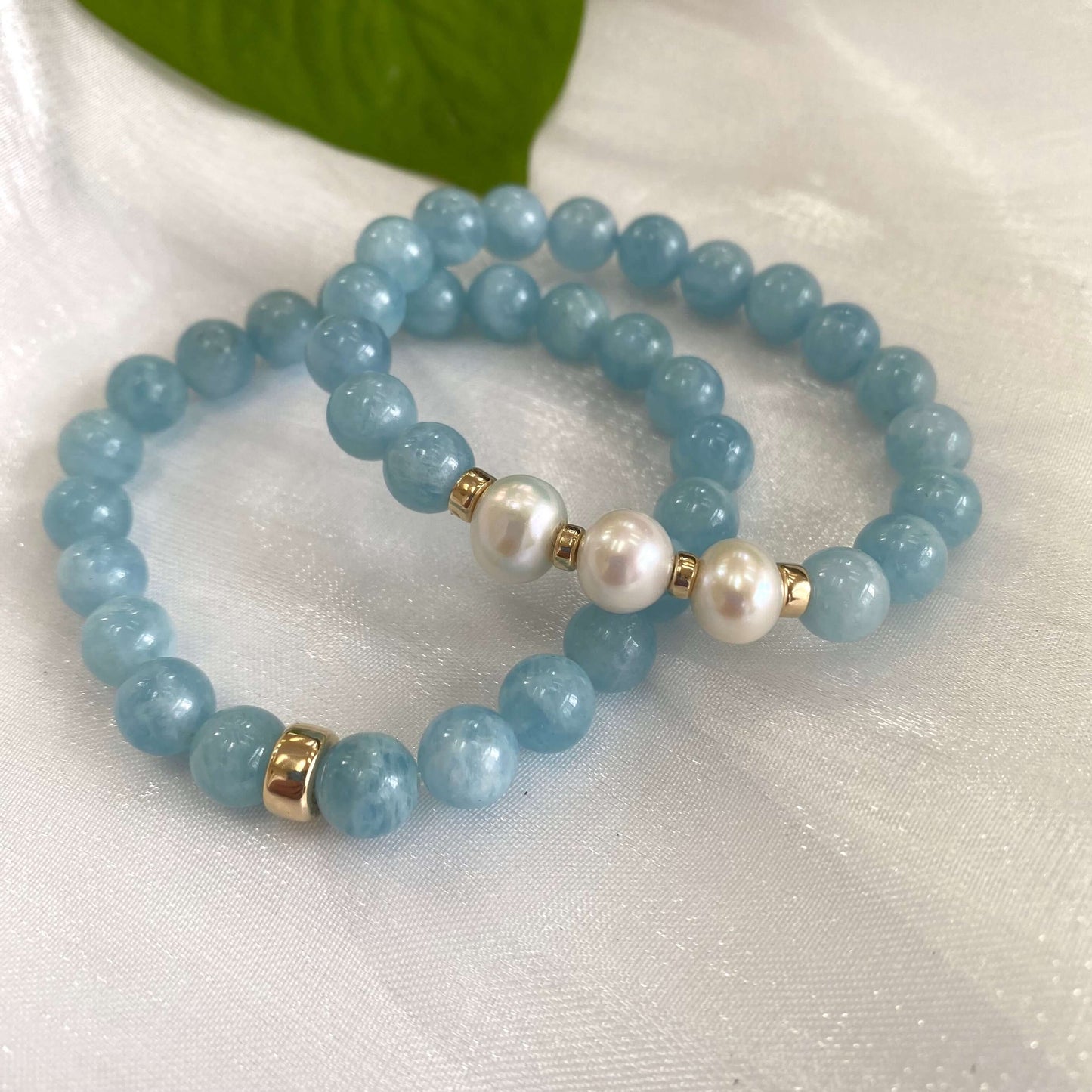 Aquamarine pearl bracelet featuring 8mm aquamarine beads and 9-10mm freshwater pearls with 14K gold filled accents.