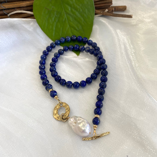 Lapis lazuli baroque pearl necklace handcrafted in Canada with deep blue beads and a luminous baroque pearl.