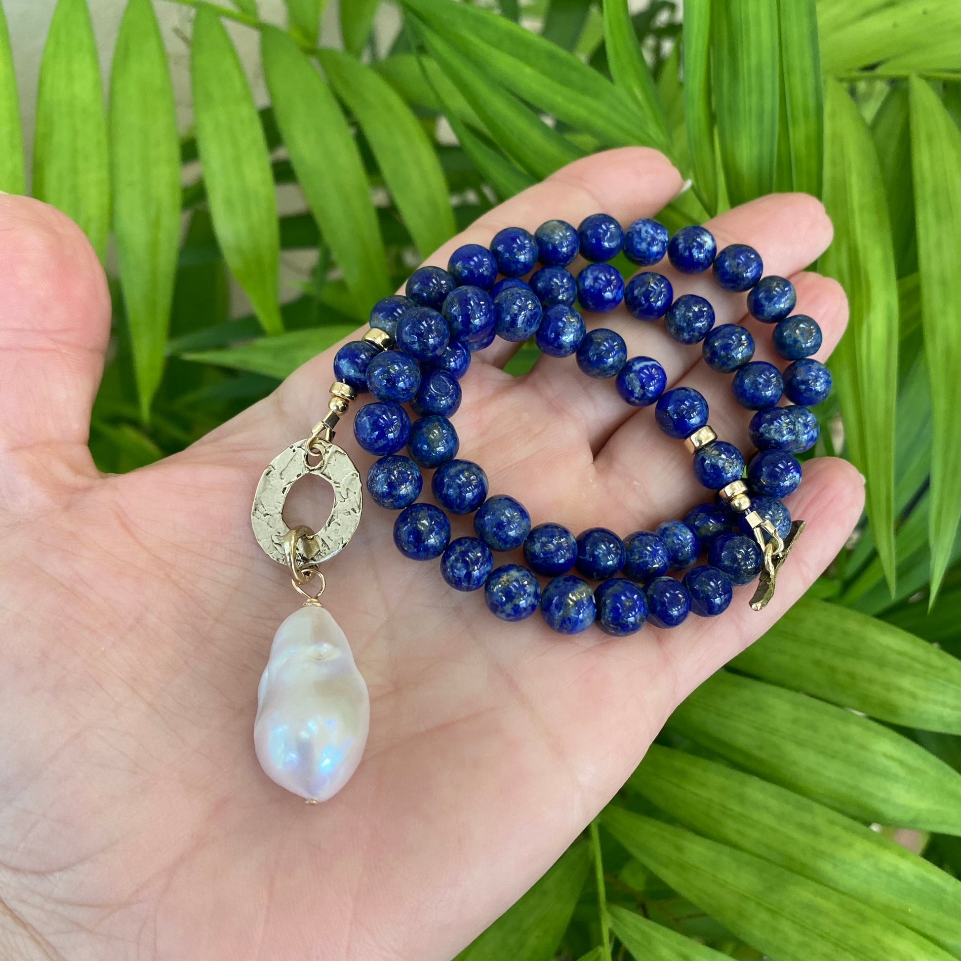 Lapis lazuli baroque pearl necklace showing rich blue beads and organic pearl shape