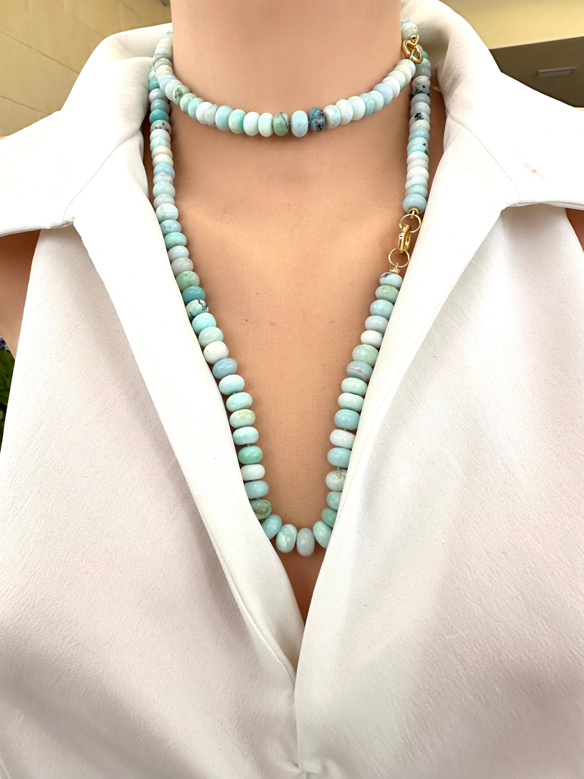 Blue Peru Opal Necklace Gold worn long with open collar, hand-knotted opal beads and gold clasp