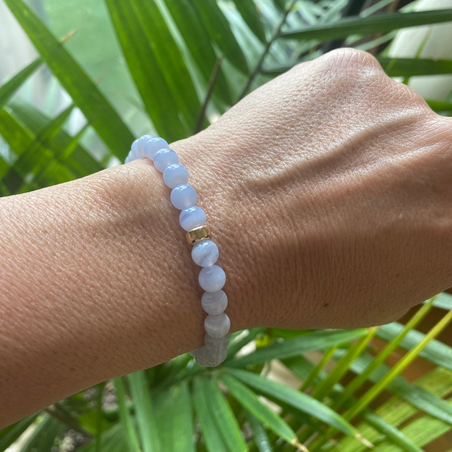 Blue Lace Agate Bracelet worn on woman’s wrist – single bracelet lifestyle image