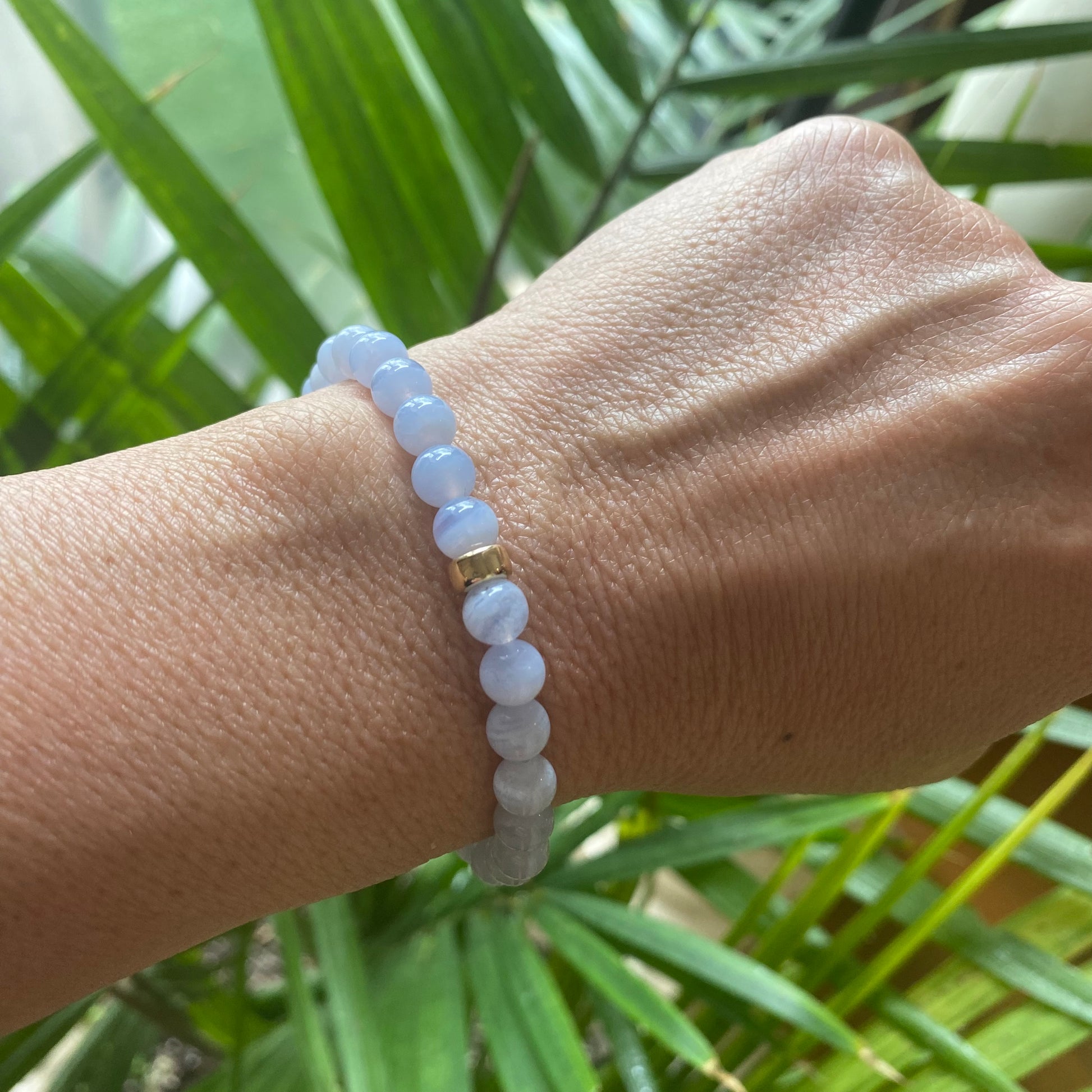 Blue Lace Agate Bracelet worn on woman’s wrist – single bracelet lifestyle image