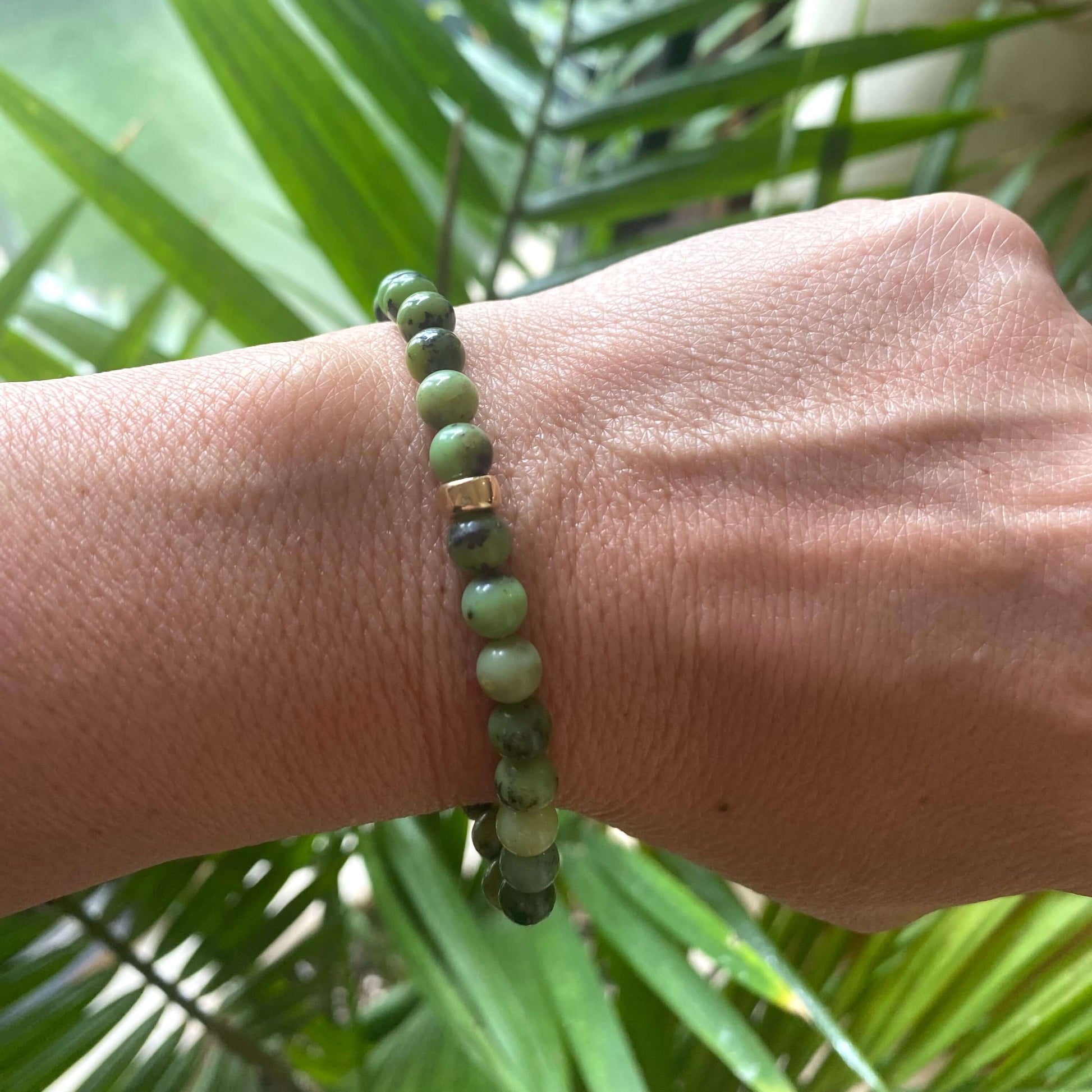 Chrysoprase Stretch Bracelet – 6mm Beads in 14K Gold Filled worn on wrist with green tones and natural design