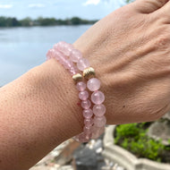 Rose Quartz Bracelet worn on woman’s wrist – stacked natural light shot