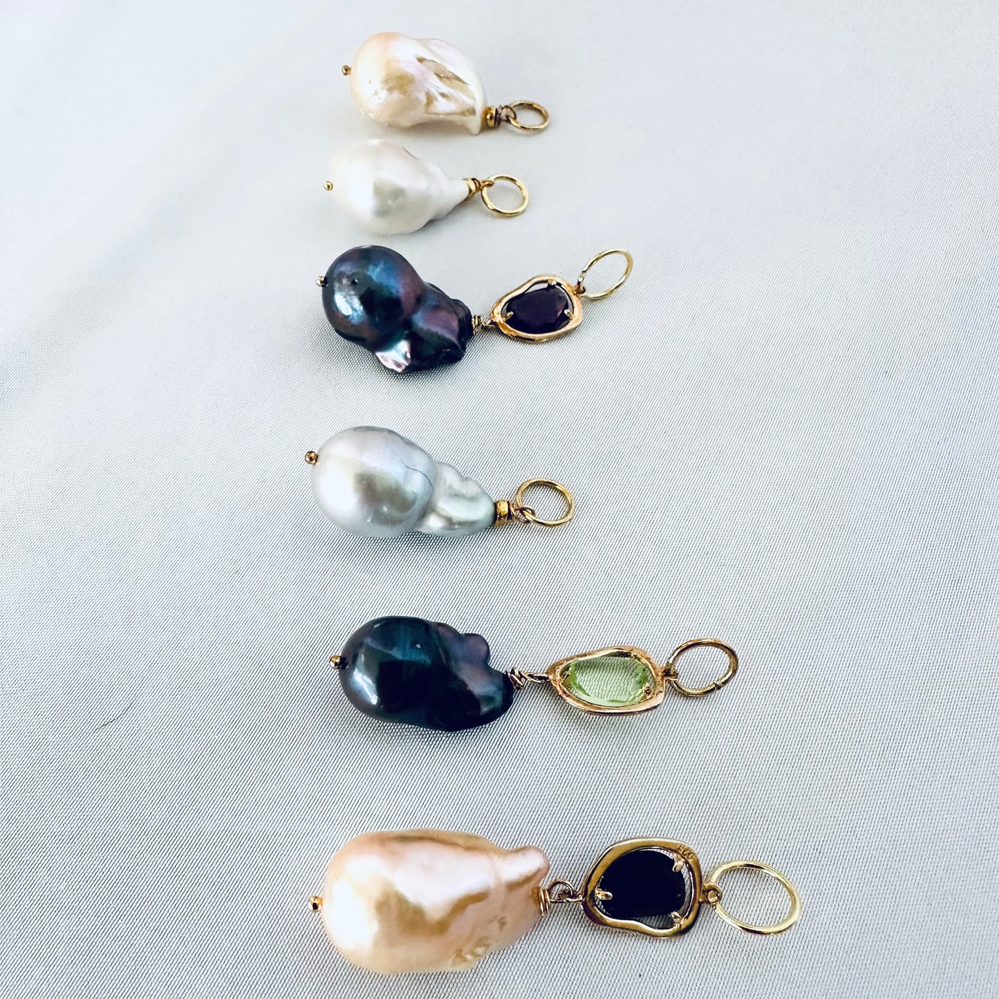 Aquamarine baroque pearl necklace featuring various pearls and gemstones in an elegant design.