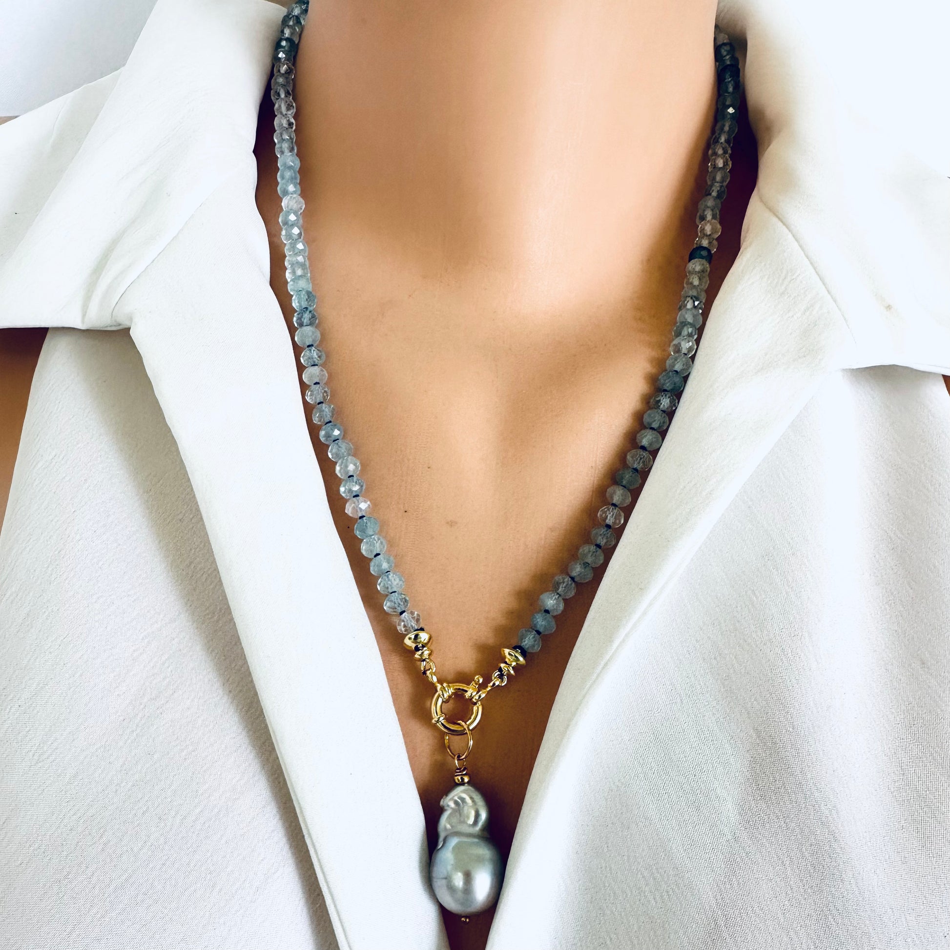 Aquamarine baroque pearl necklace featuring tender blue beads and a luminous Baroque pearl pendant.