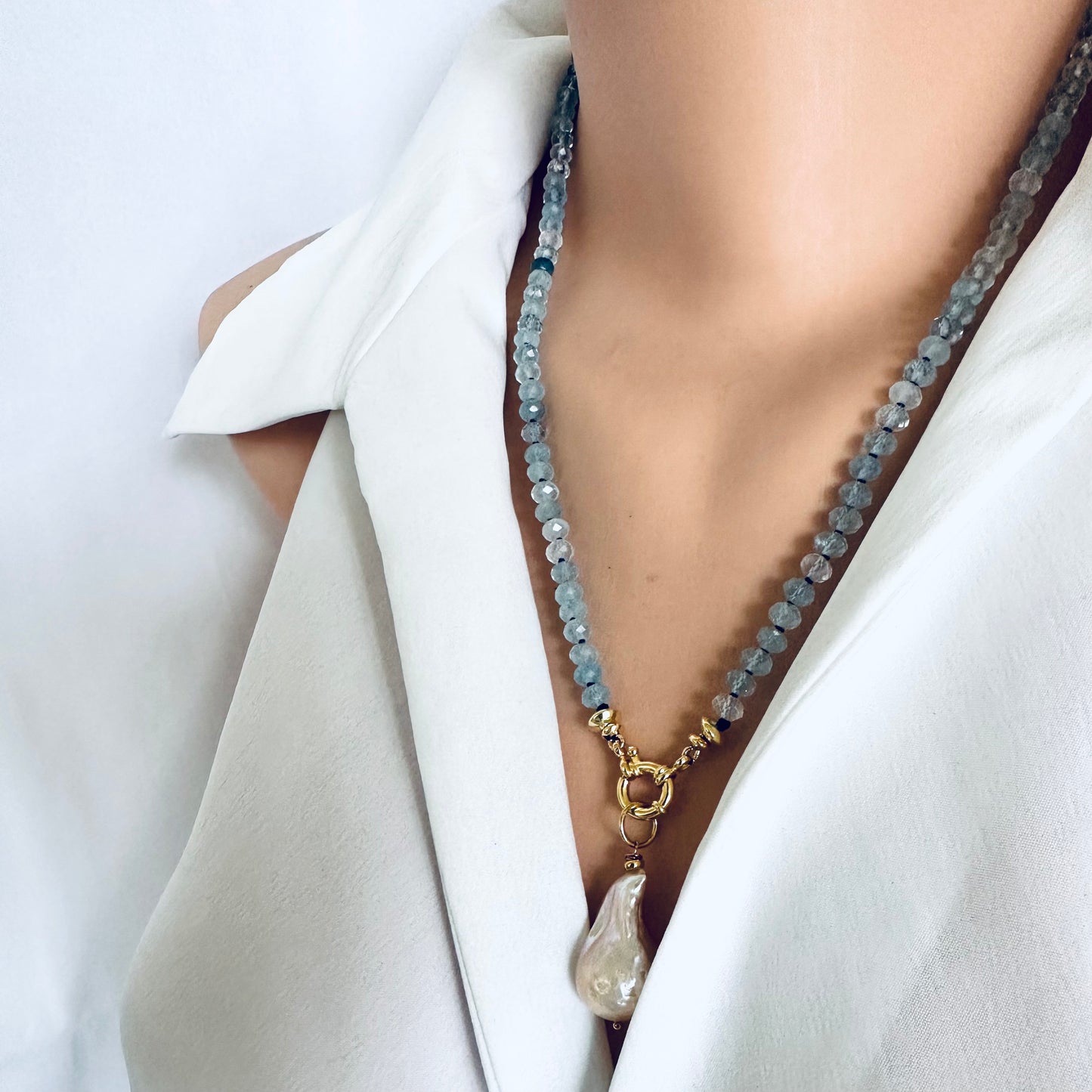 Aquamarine baroque pearl necklace featuring blue Aquamarine beads and a Baroque pearl pendant.