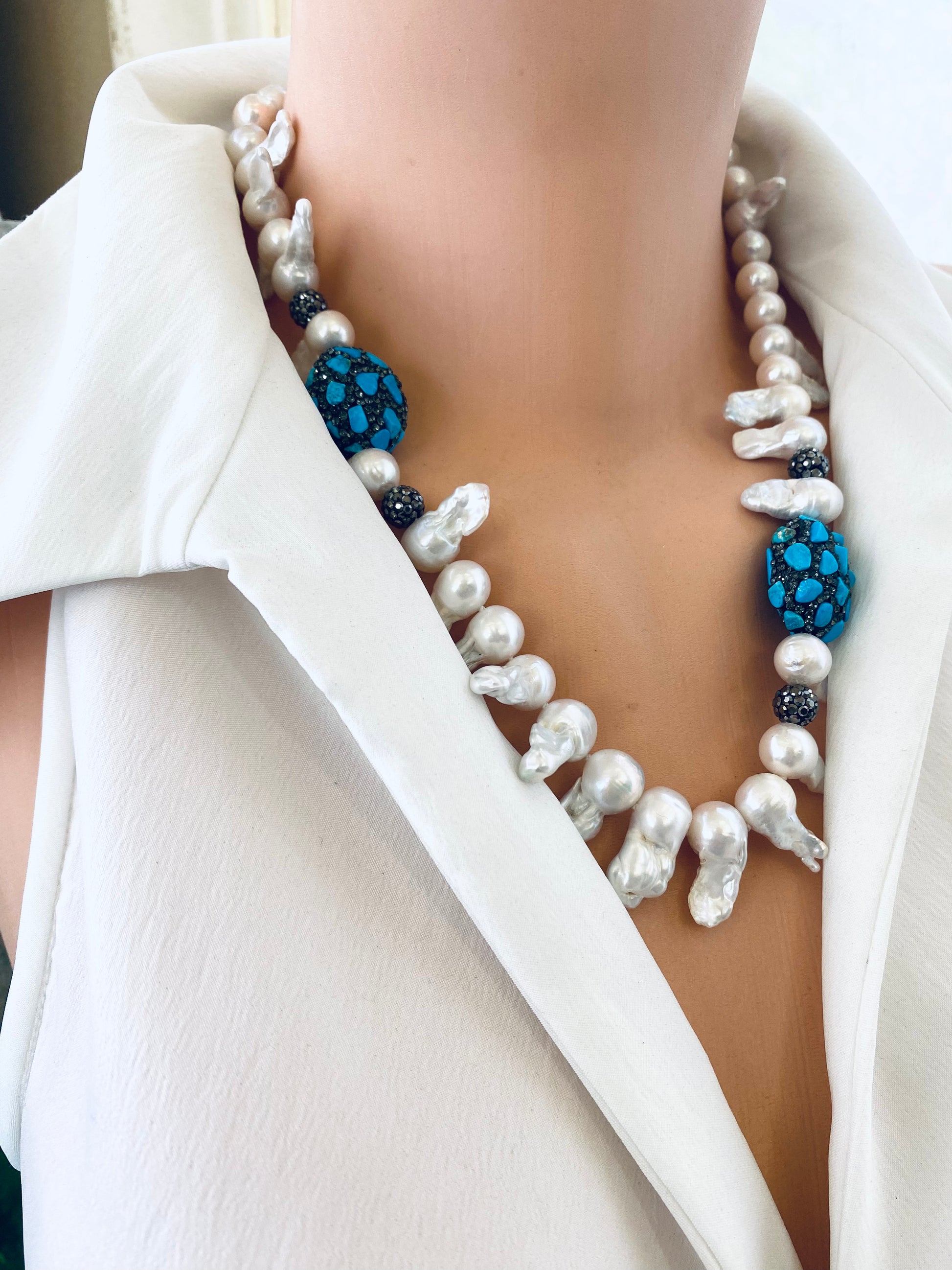 Close up baroque pearl jellyfish necklace draped on mannequin handmade in Canada