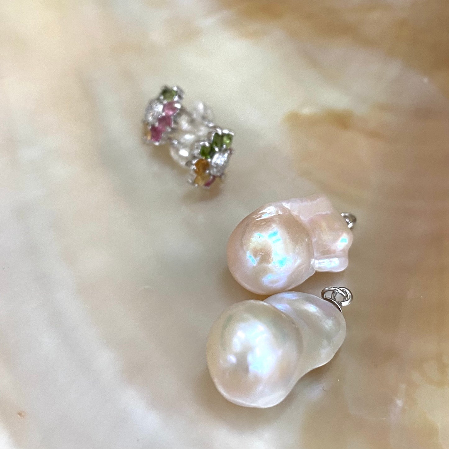 Convertible tourmaline pearl earrings shown with separate flower studs and removable baroque drops