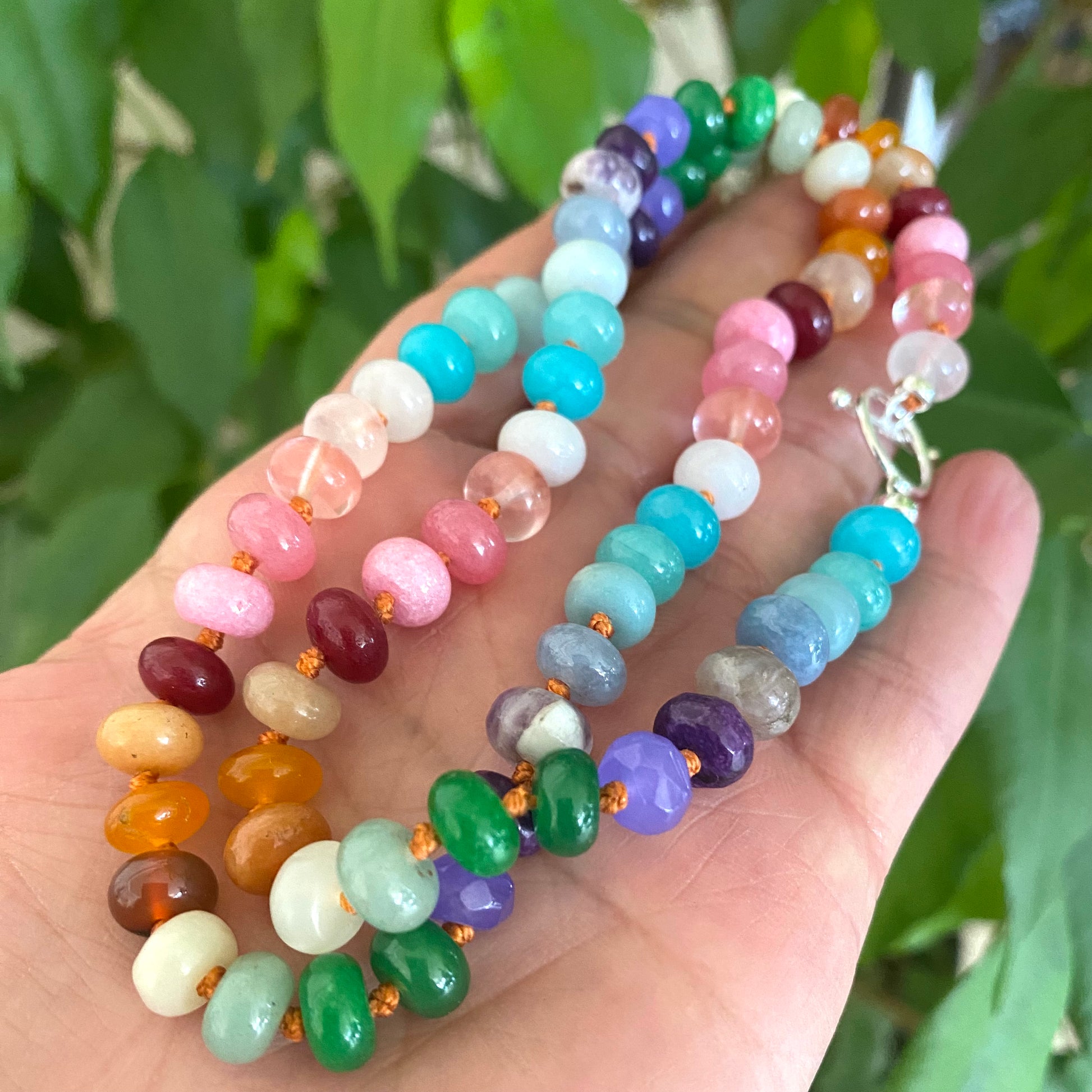 Colorful rainbow candy necklace with silver clasp showcasing vibrant gemstone rondelle beads and artisanal craftsmanship.