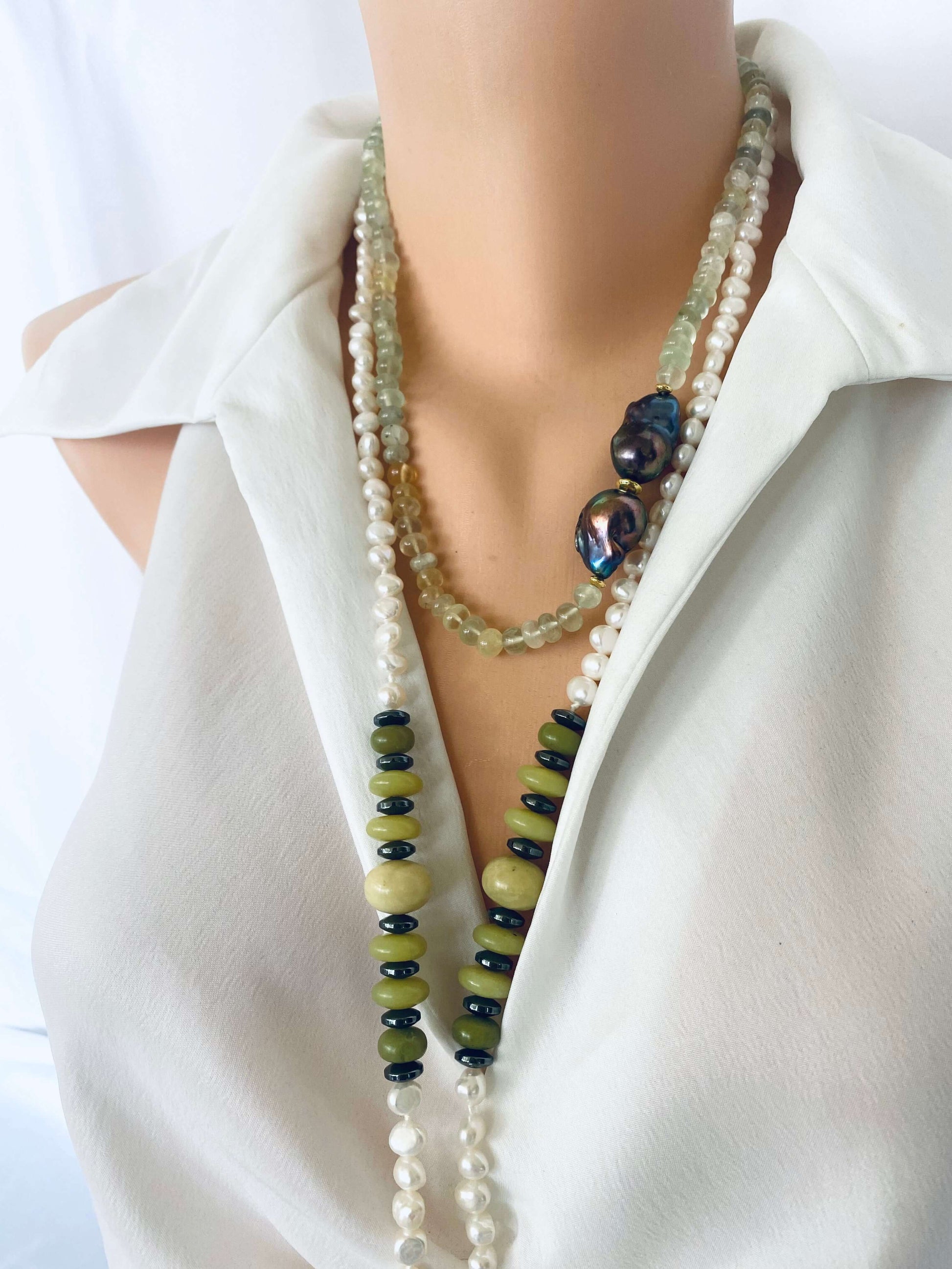 Prehnite and Black Baroque Pearl Necklace displayed on a mannequin, showcasing handcrafted elegance with gemologist details.