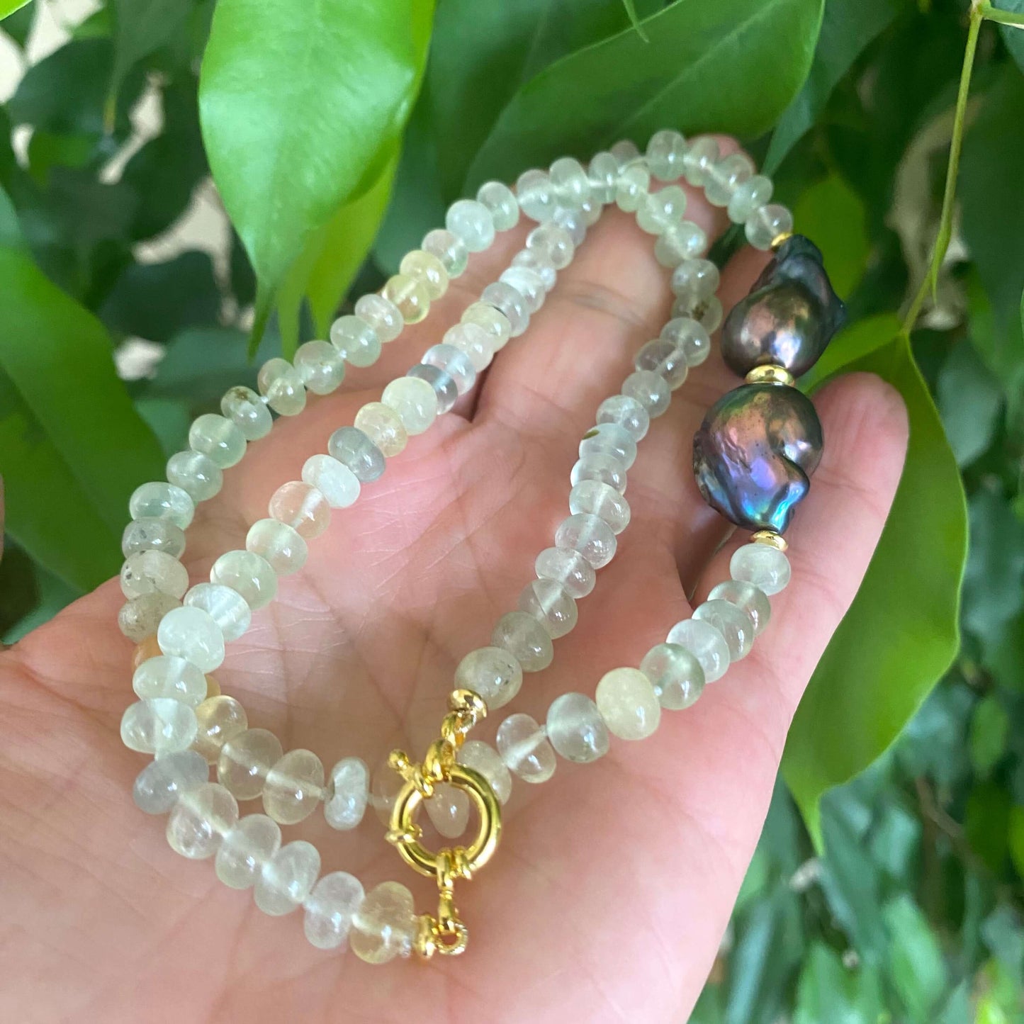 Prehnite and Black Baroque Pearl Necklace featuring translucent green prehnite beads and bold black baroque pearls.