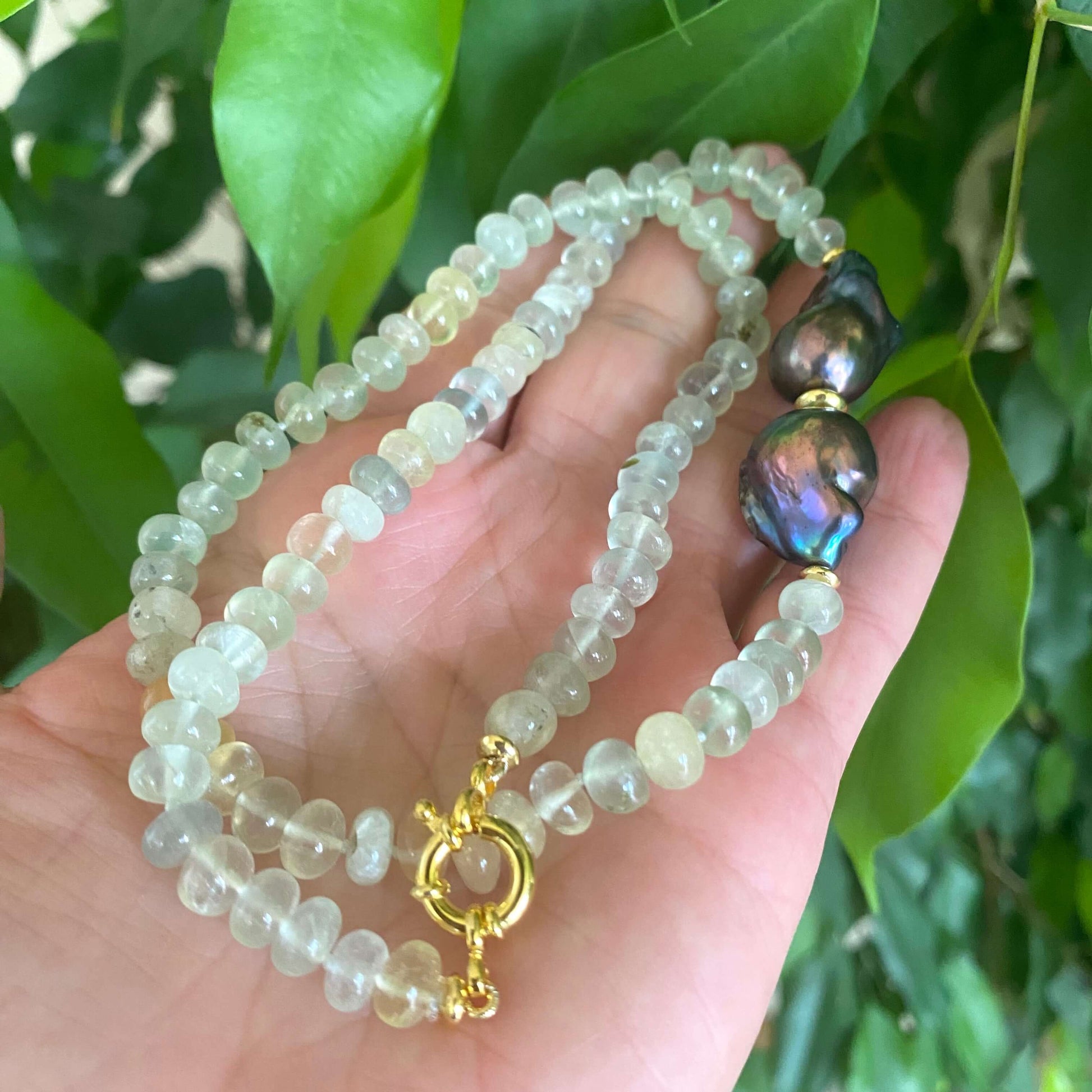 Prehnite and Black Baroque Pearl Necklace featuring translucent green prehnite beads and bold black baroque pearls.