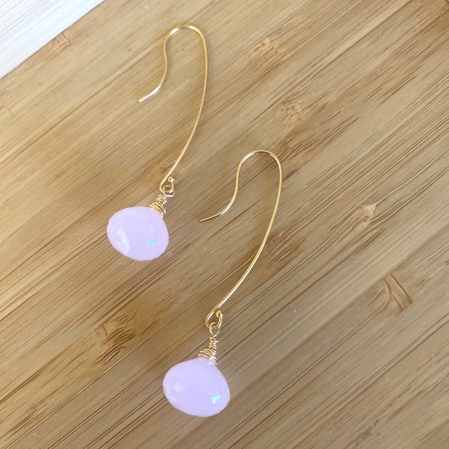 Rose quartz threader earrings with briolettes showcasing a delicate design and blush-pink tones.