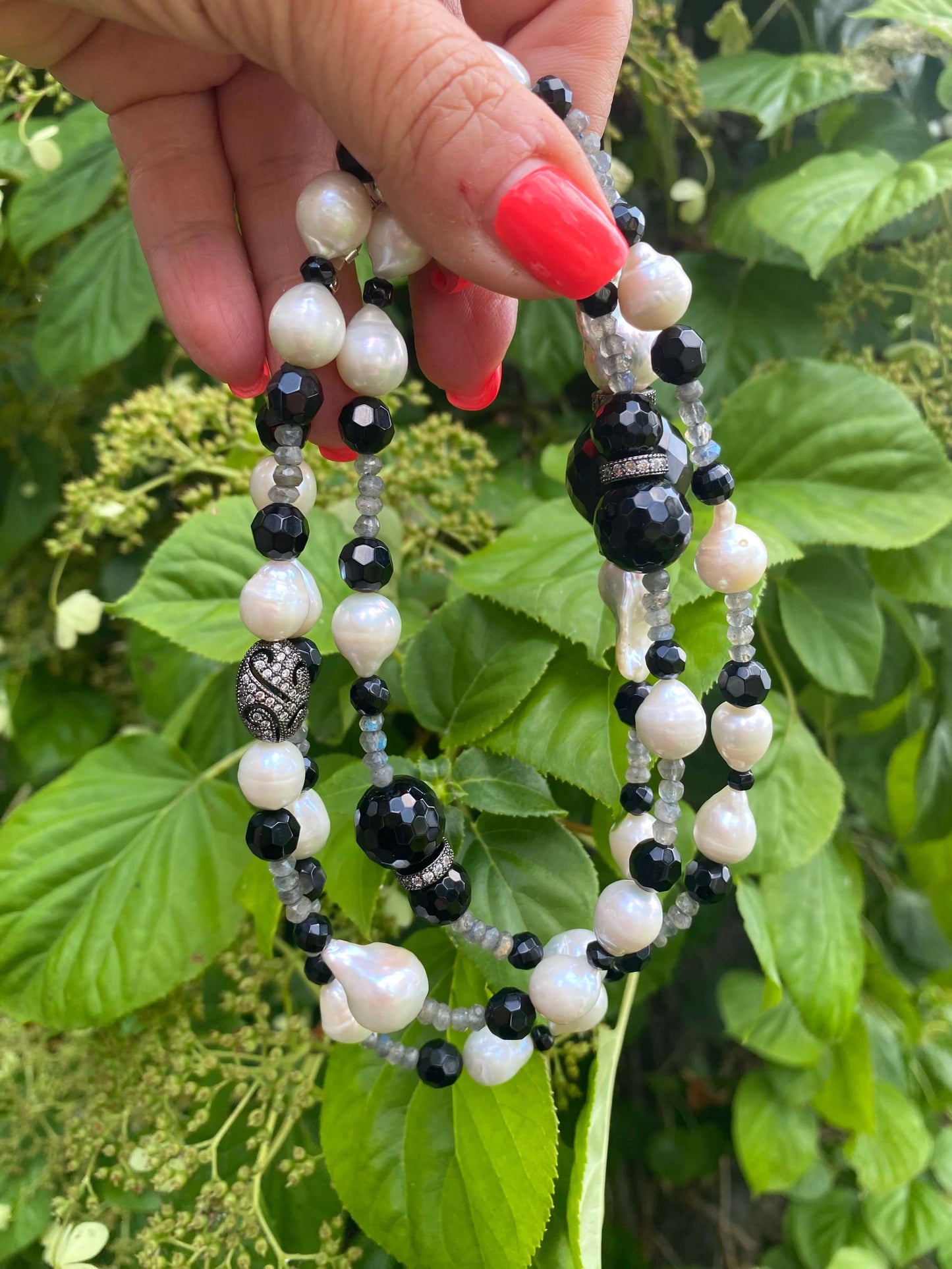 Close-up of labradorite onyx pearl long necklace showcasing handcrafted design and genuine gemstones.