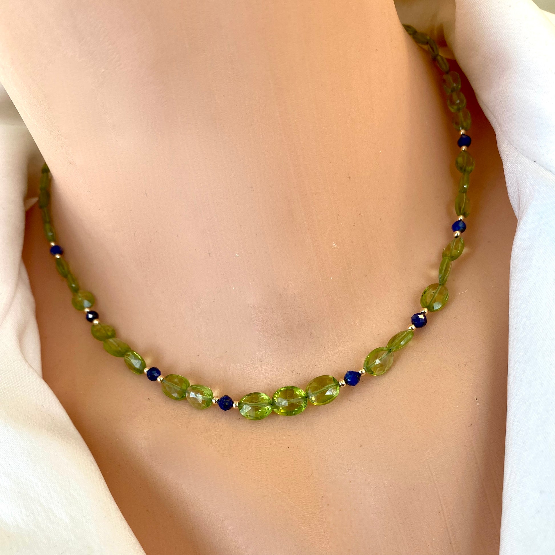 Peridot lapis necklace featuring faceted peridot beads and blue lapis lazuli accents for a refined jewelry piece.