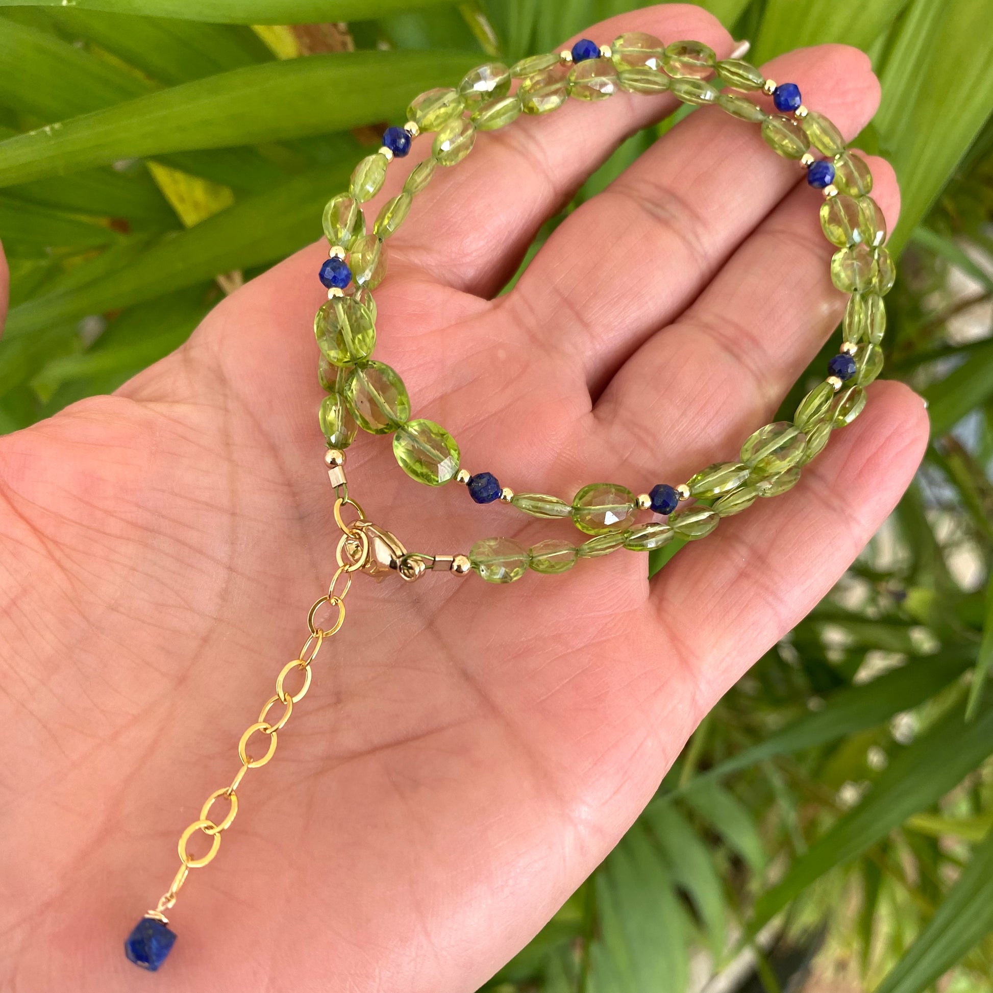 Peridot lapis necklace featuring vibrant green peridot and blue lapis lazuli beads, showcasing minimalist elegance.