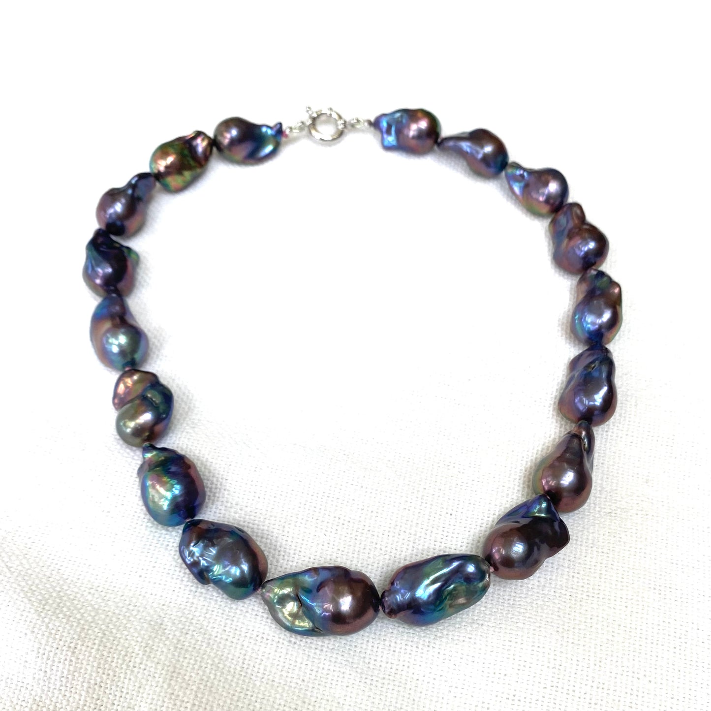 Black Baroque Pearl Necklace | Handcrafted Chunky Design featuring unique peacock-black pearls on silk thread.
