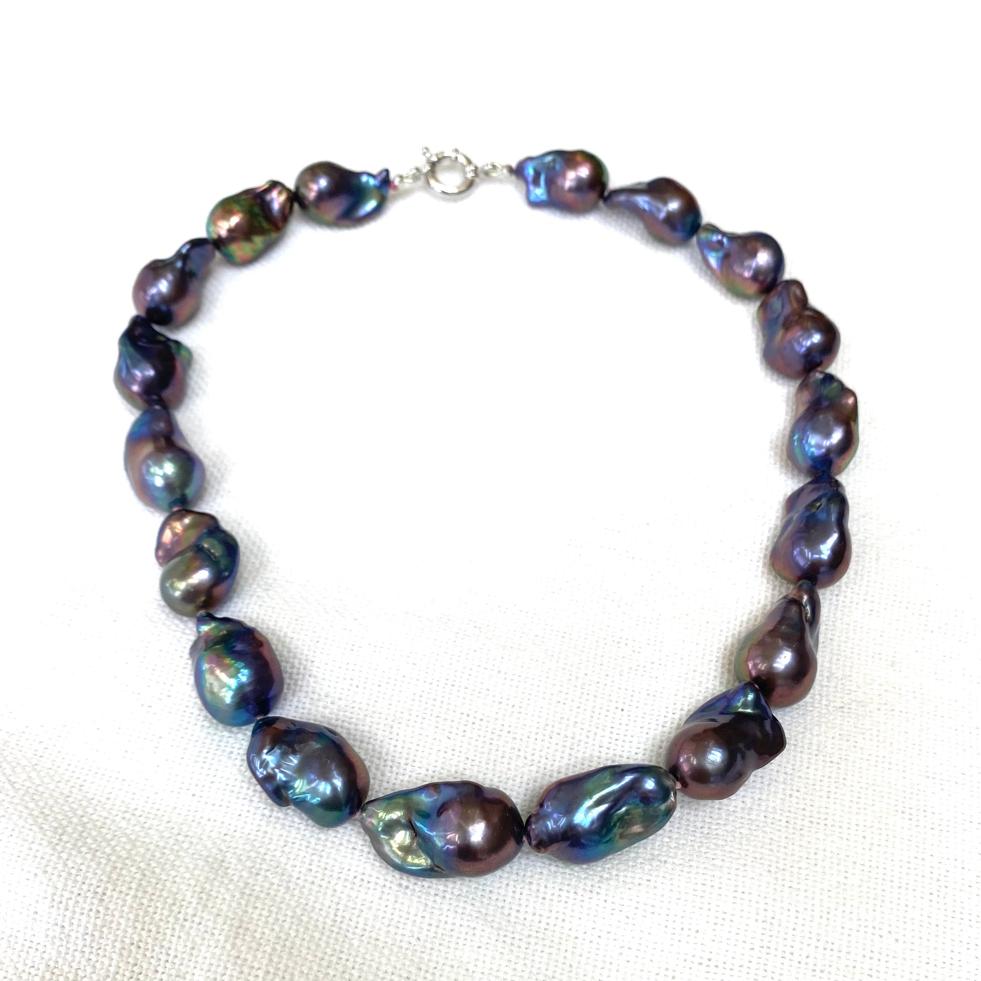 Black Baroque Pearl Necklace | Handcrafted Chunky Design featuring unique peacock-black pearls on silk thread.