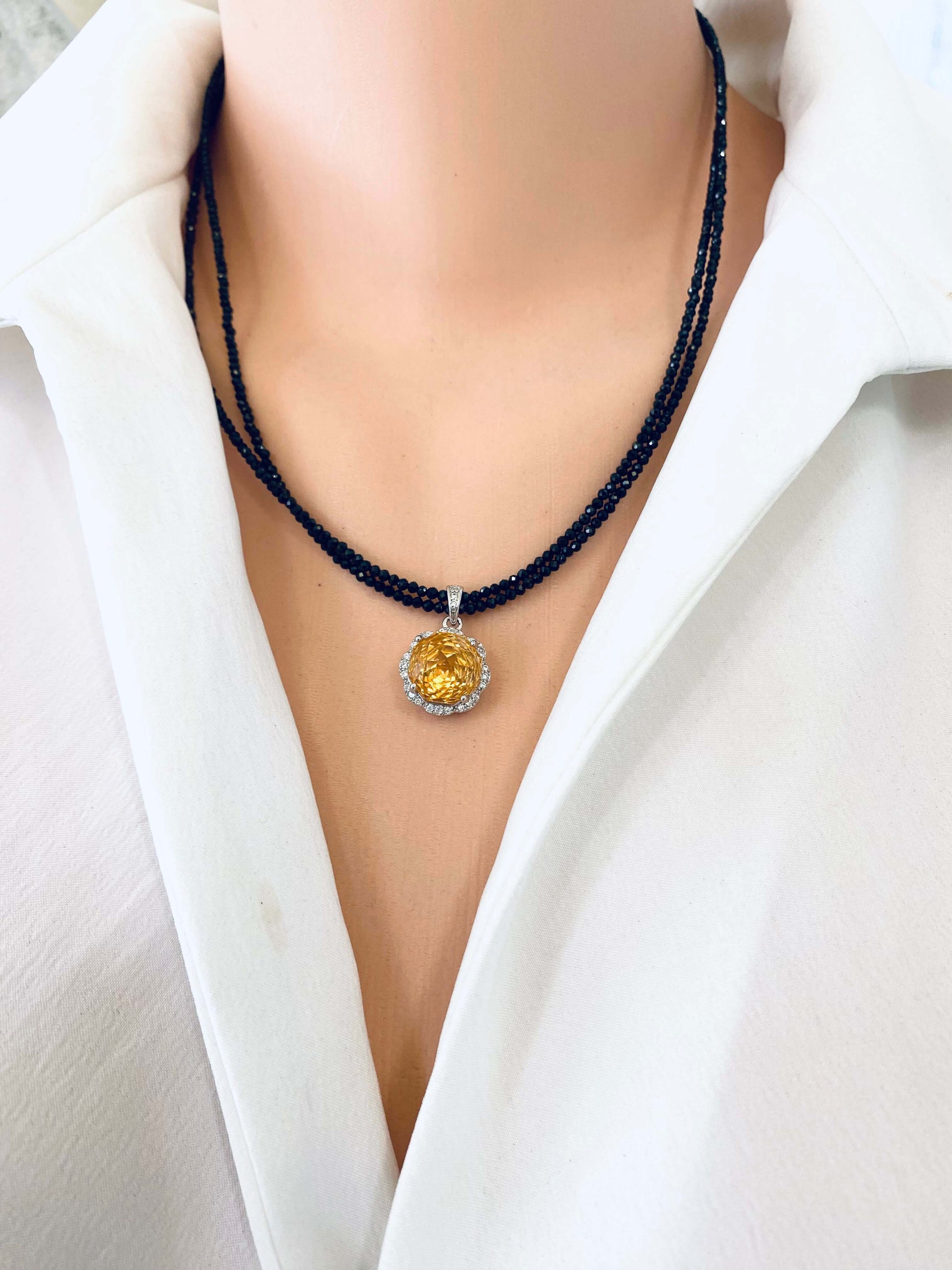 Front view of black spinel and citrine pendant necklace, 19 inch length display
