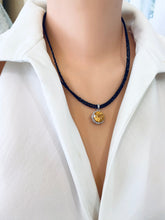 Lade das Bild in den Galerie-Viewer, Close-up side angle of black spinel and citrine pendant necklace with silver clasp
