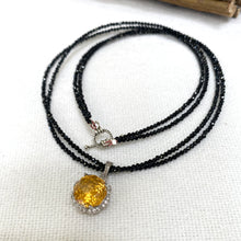 Lade das Bild in den Galerie-Viewer, Black spinel and citrine pendant necklace on white background, handmade silver design
