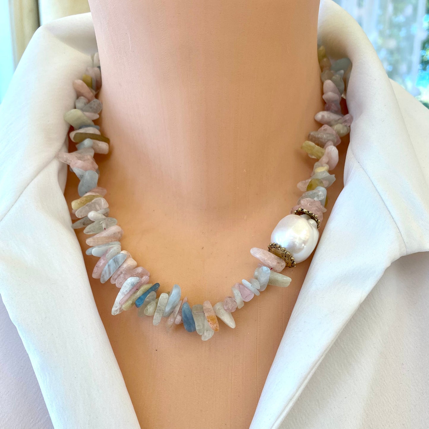 Morganite aquamarine necklace featuring pastel gemstones and a baroque pearl detail.