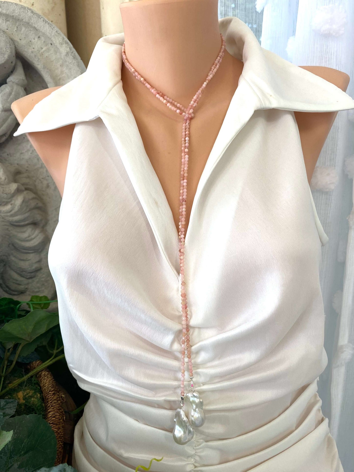 Pink Opal Baroque Pearl Necklace displayed on mannequin, showcasing its lariat design and elegant pink opal beads.