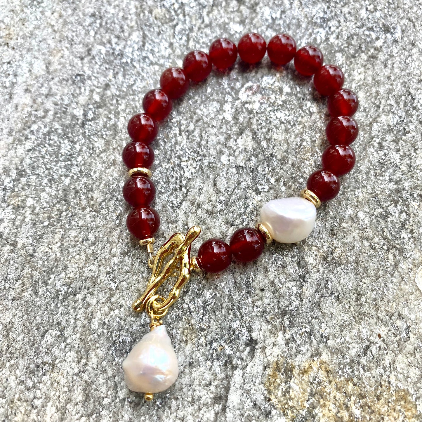 Carnelian pearl bracelet with white baroque pearl handcrafted from burnt orange carnelian beads.