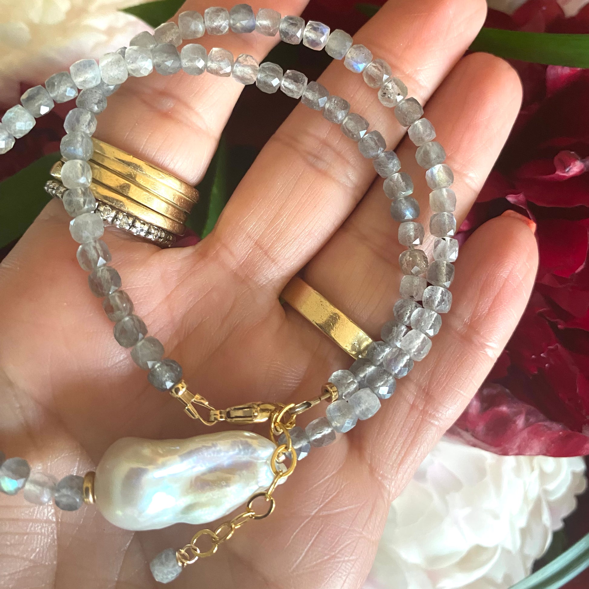 Labradorite necklace with blue flash and baroque pearl, showcasing handcrafted gray beads and elegant design.