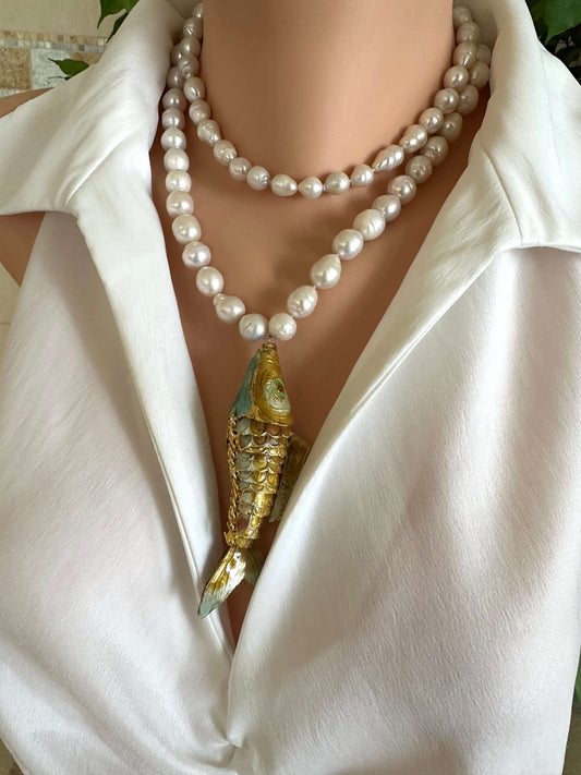 Baroque pearl necklace with fish pendant showcasing hand-knotted white baroque pearls and a stunning fish charm.
