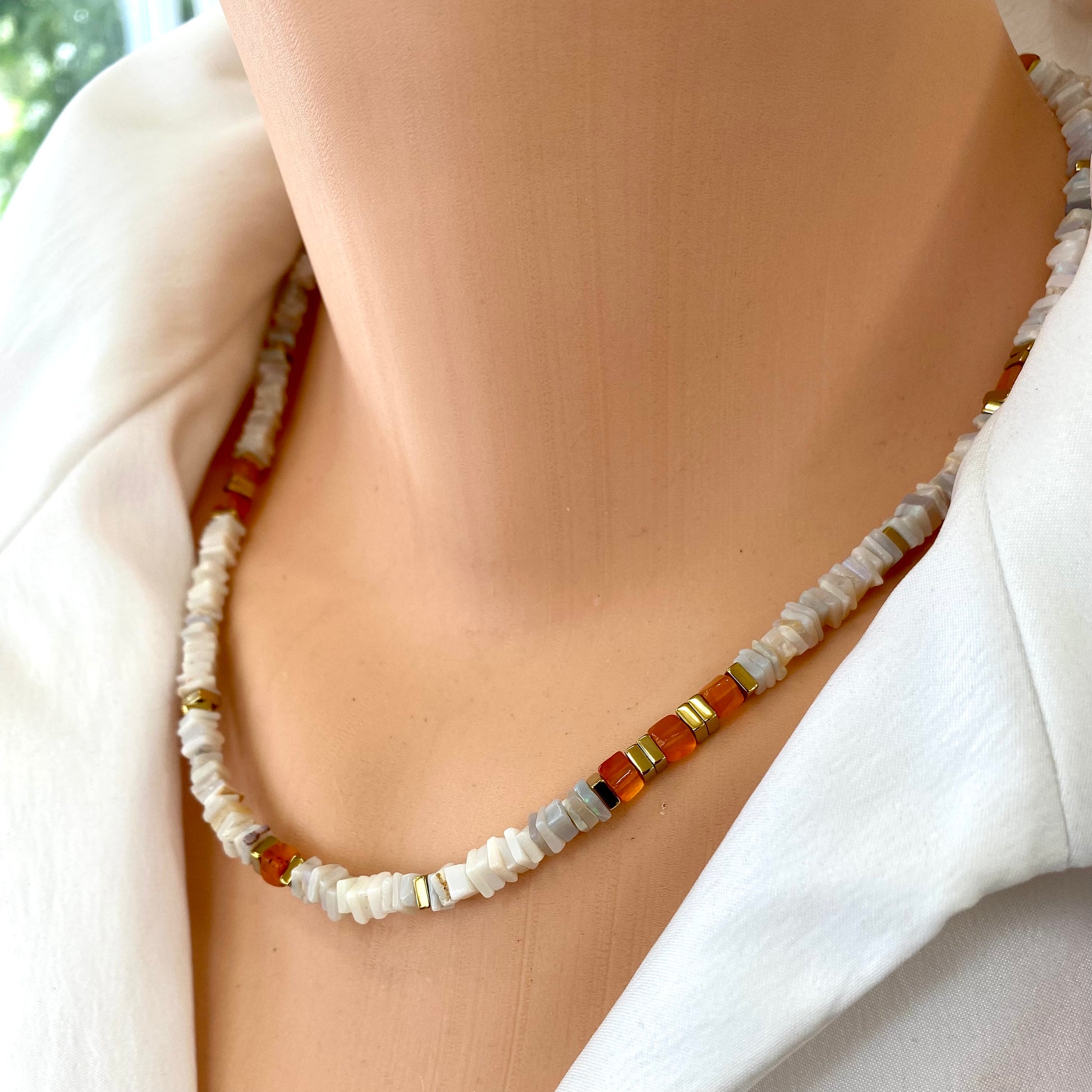 Opal carnelian necklace worn at the neckline with natural opal and carnelian gemstones