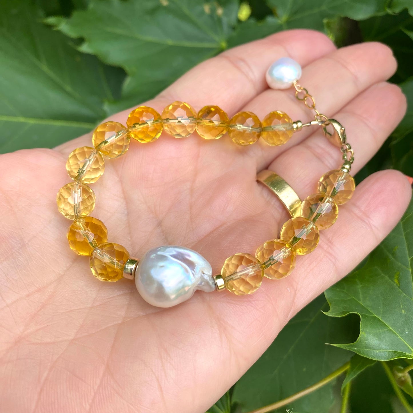 Citrine pearl bracelet featuring AAA-quality faceted citrine beads and a baroque pearl in handcrafted design.