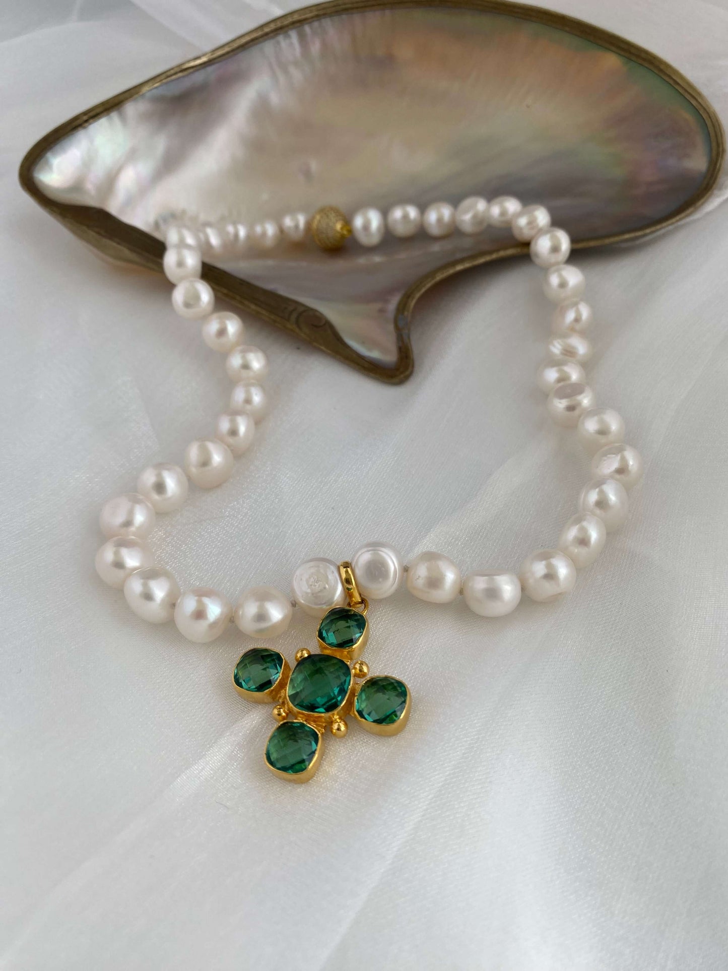 Potato pearl necklace with cross pendant featuring gold plated Green Quartz and hand-knotted freshwater pearls.