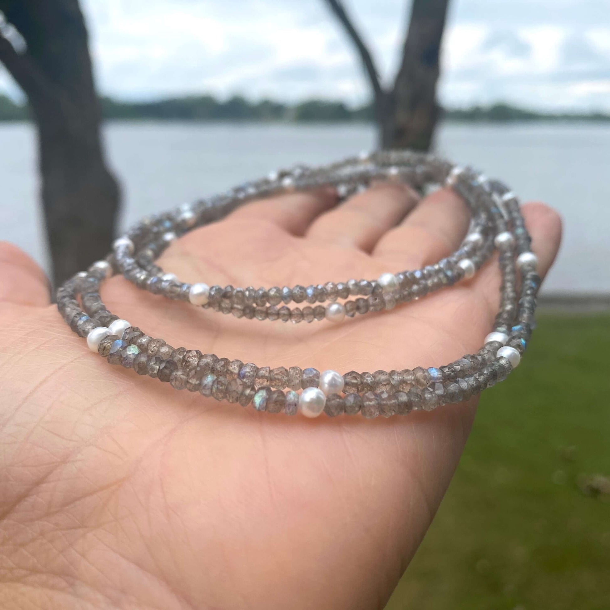 Labradorite freshwater pearl necklace showcasing faceted labradorite gemstones and freshwater pearls in a handcrafted design.