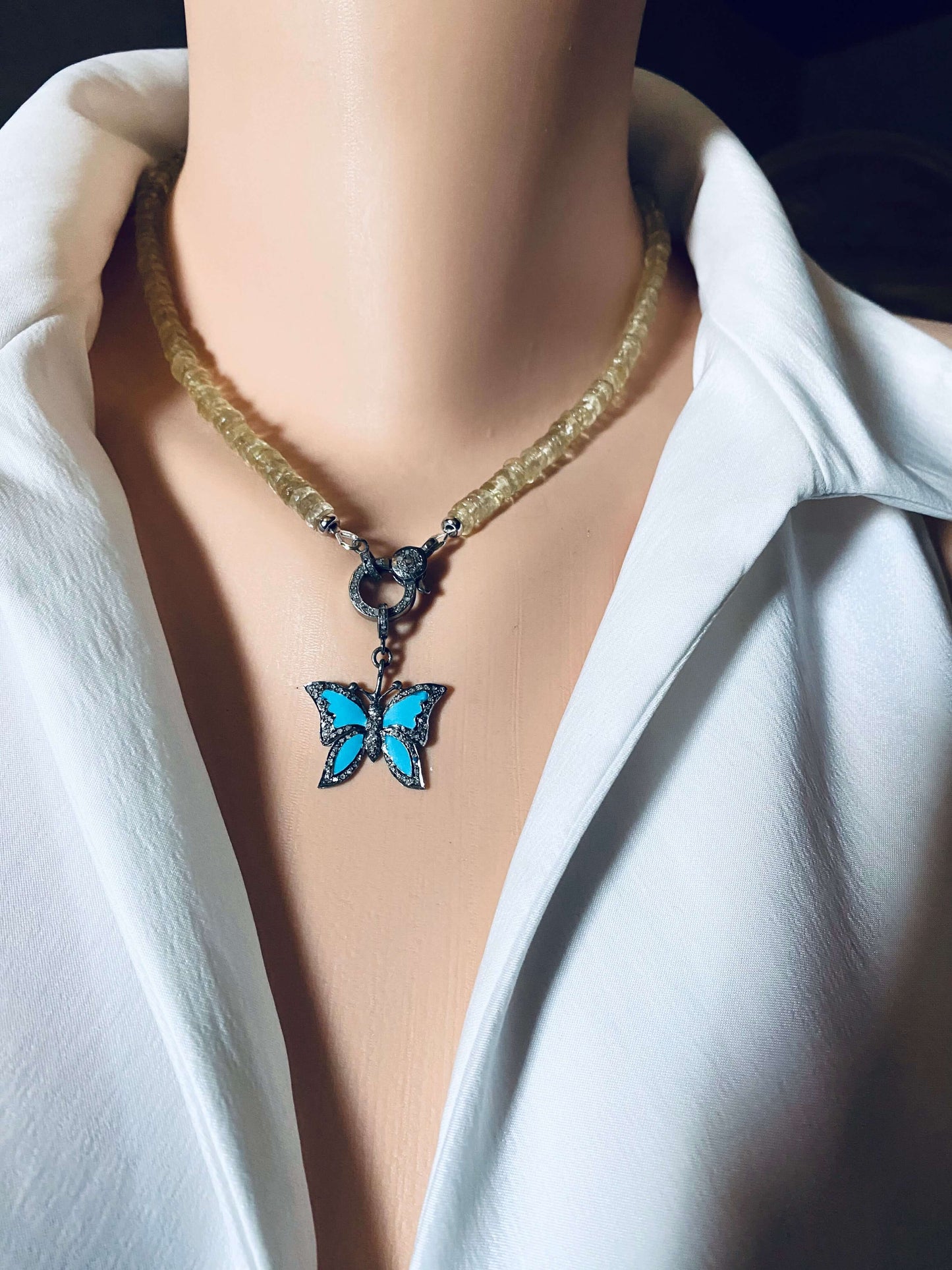 Lemon quartz beaded necklace with oxidized silver pavé clasp, showcasing a butterfly charm pendant.