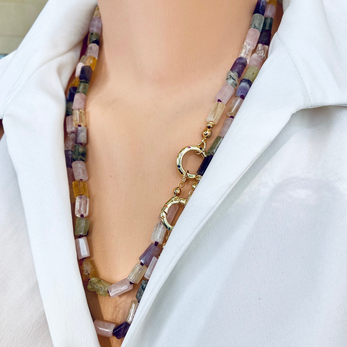 Mixed gemstone necklace worn on neck with pastel tube beads and gold plated clasp, handmade Canadian jewelry