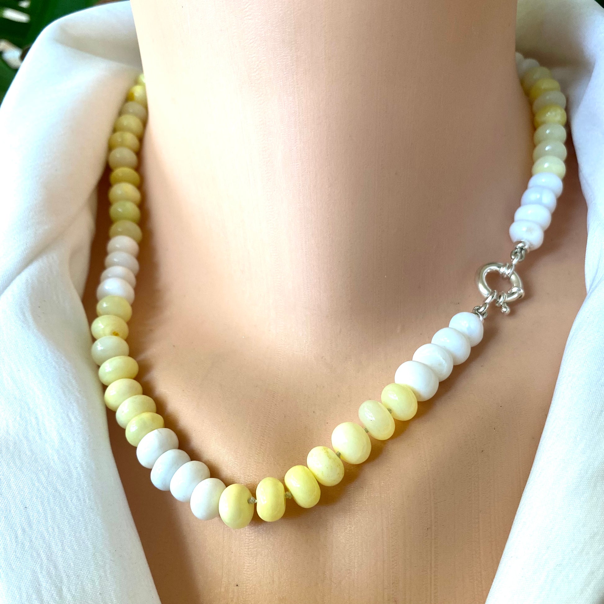 Yellow opal beaded necklace in sterling silver worn on neckline