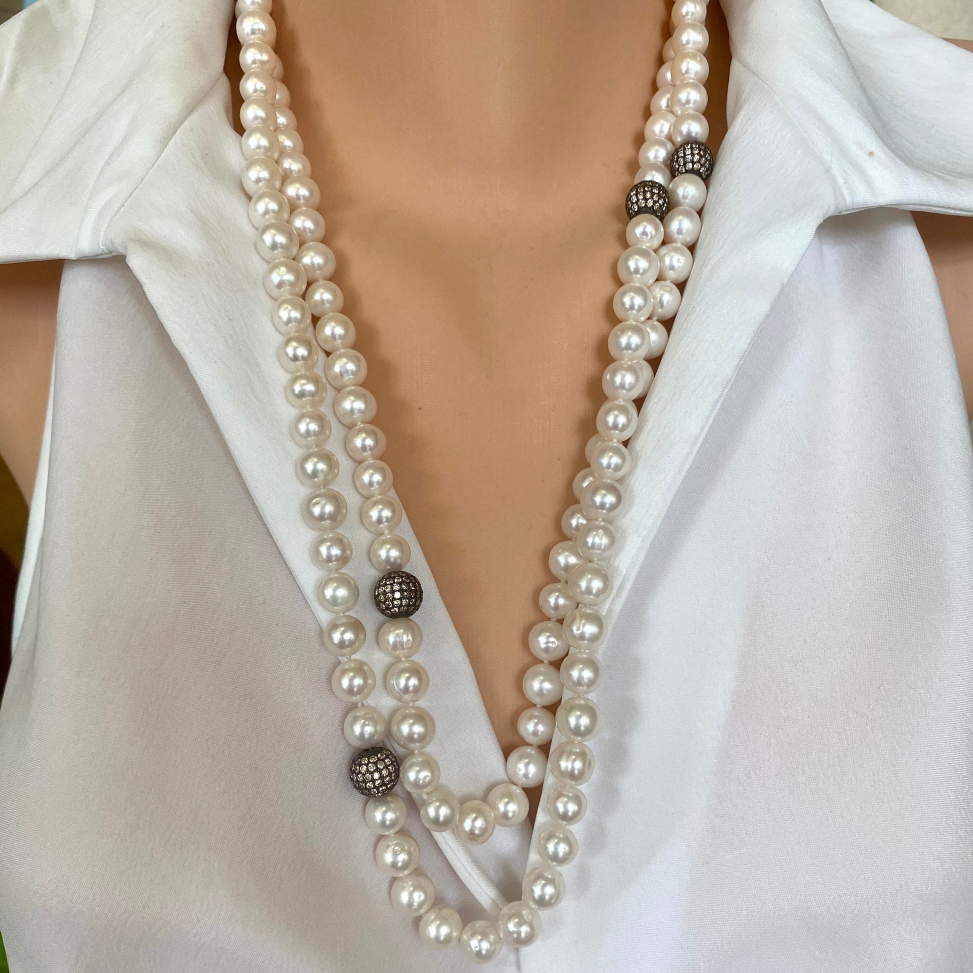 Long freshwater pearl necklace with CZ pave beads displayed on mannequin, handcrafted in Canada.