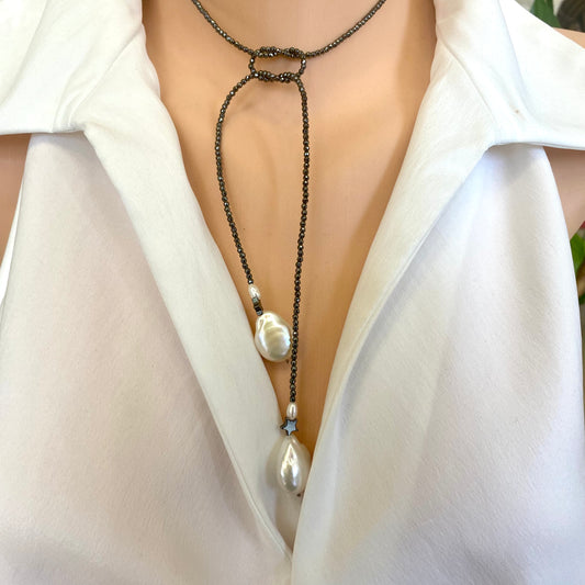 Hematite baroque pearl lariat necklace worn on model showing adjustable lariat styling