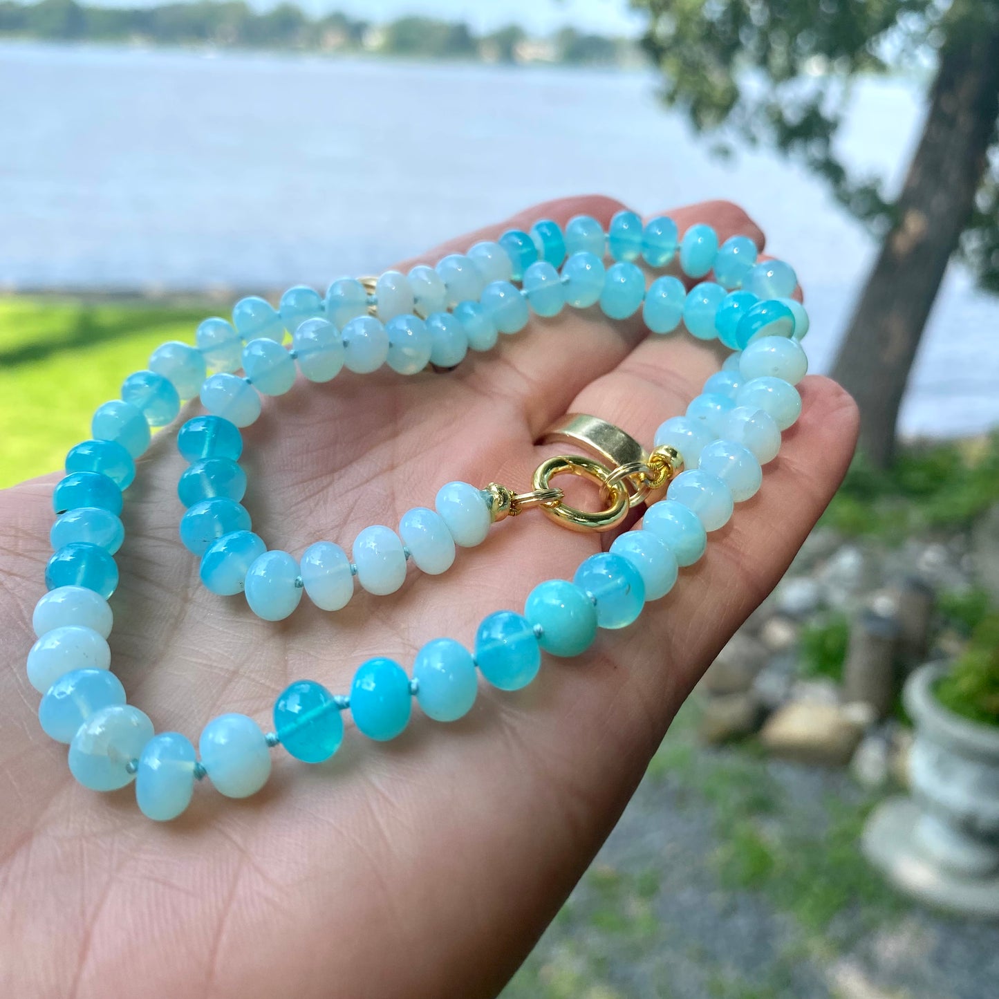 Opal candy necklace featuring bright sky blue opal rondelle beads, capturing spring and summer hues.